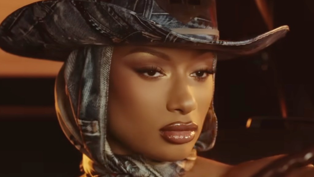 Megan Thee Stallion Bares Her Thick Curves in a Sheer Micro Mini Held by a Tiny Chain