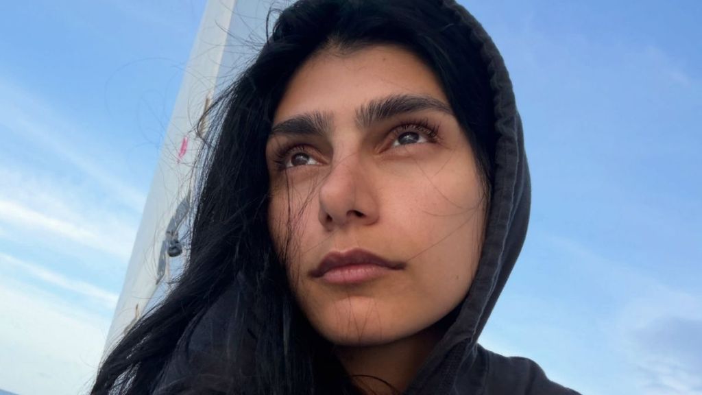 Mia Khalifa Poses in Nothing But an Oversized Sweatshirt That Barely Covers Her Curves