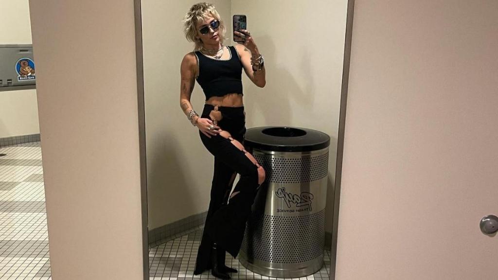 Miley Cyrus Is ‘Gagged’ in a Body-Hugging Corset Dress BTS With Barbie