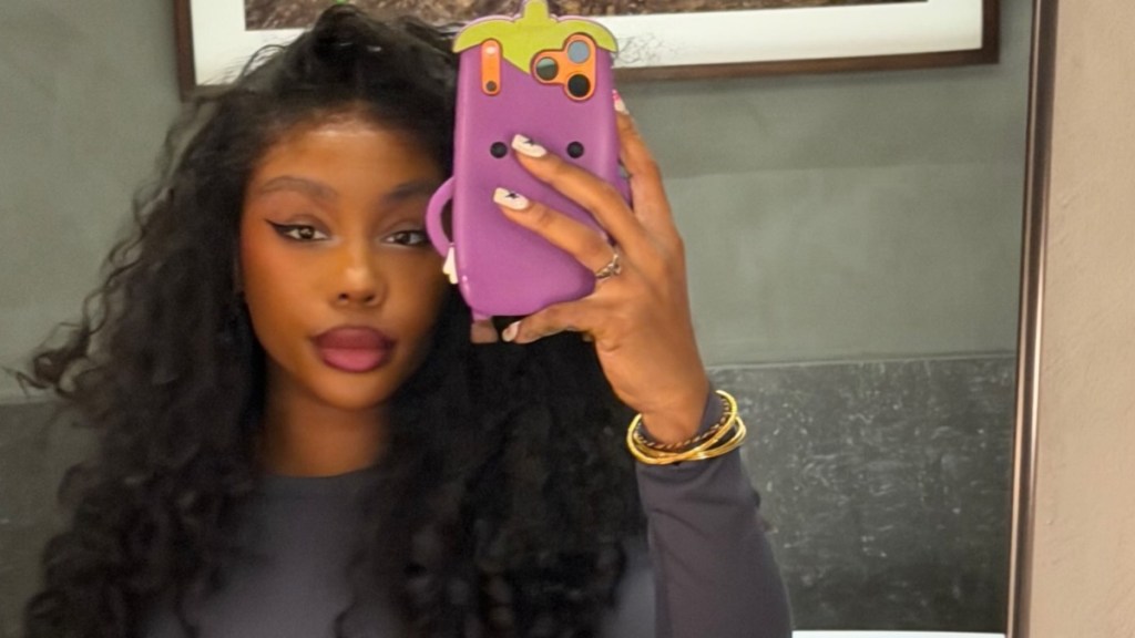 SZA’s Bold Skin-Baring Dress Features a Neckline So Low It Hits Her Waist