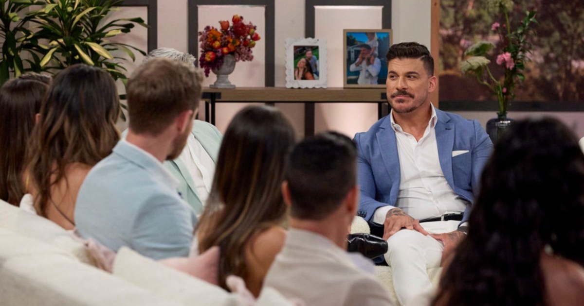 Jax Taylor in a blue suit sitting across from his castmates on The Valley Season 2 reunion