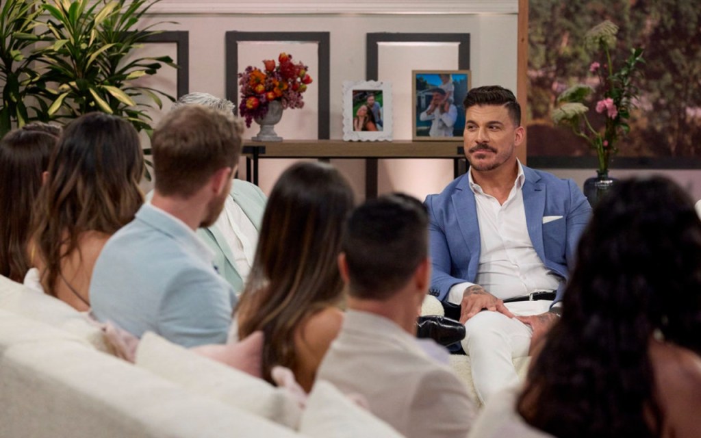 Jax Taylor in a blue suit sitting across from his castmates on The Valley Season 2 reunion