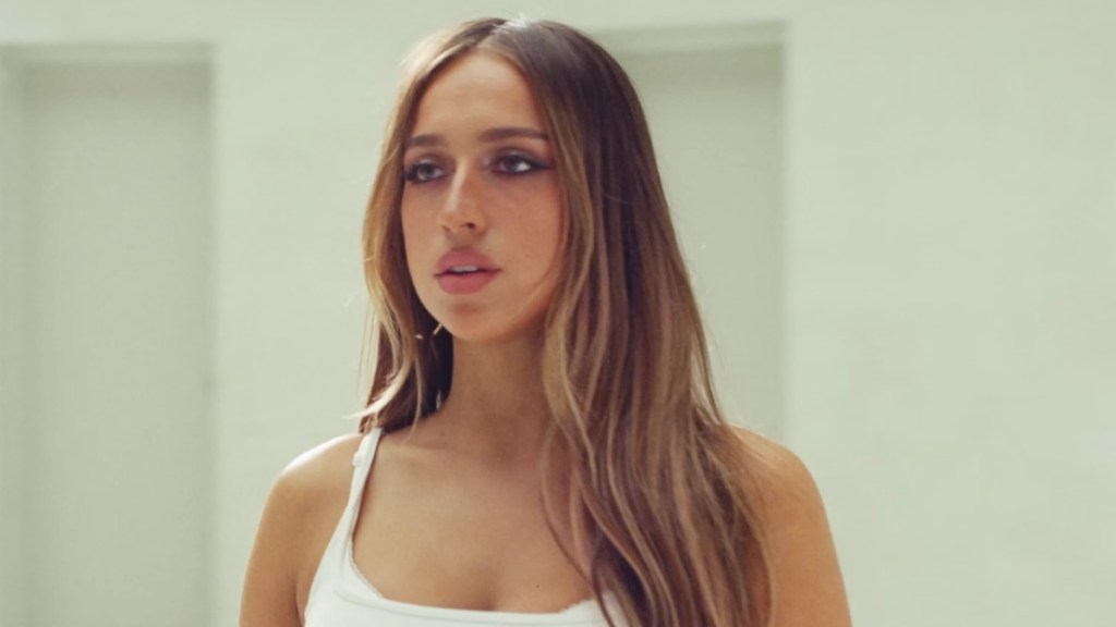 Tate McRae Nearly Spills Out of a Skin-Tight Dress That Hugs Every Curve