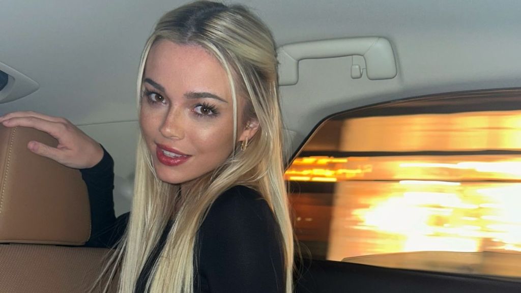 Livvy Dunne Leaves Kymi World Jacket Unzipped for Plunging Look