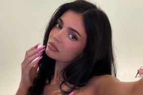 Kylie Jenner Gets Soaking Wet in Tiny Pink Bikini That Barely Hangs