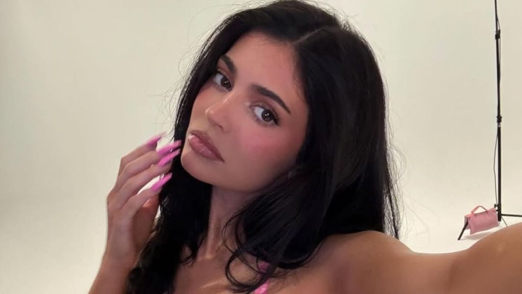 Kylie Jenner Gets Soaking Wet in Tiny Pink Bikini That Barely Hangs