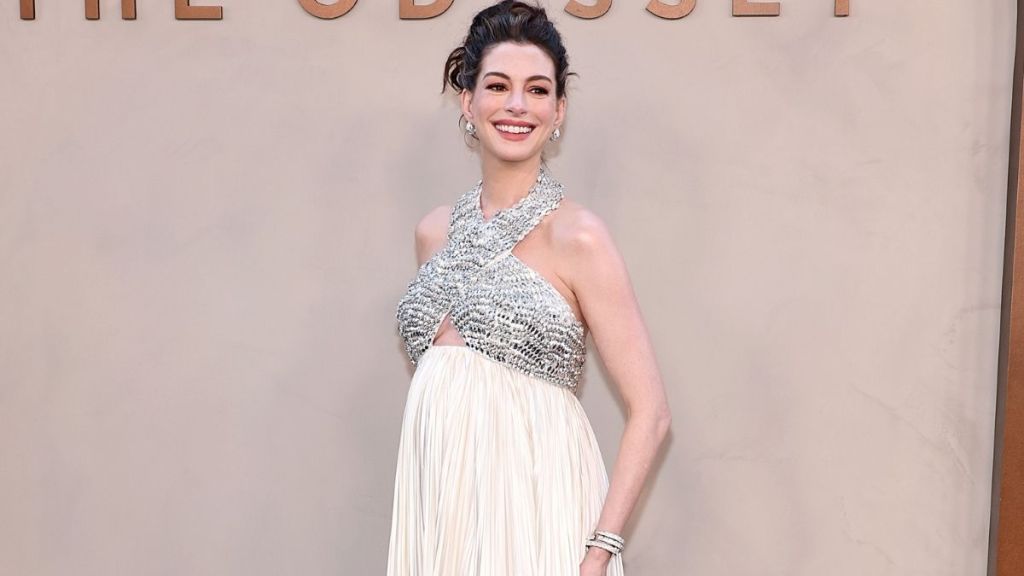 Anne Hathaway Channels Grecian Goddess in Prada Gown With Chest Cutout