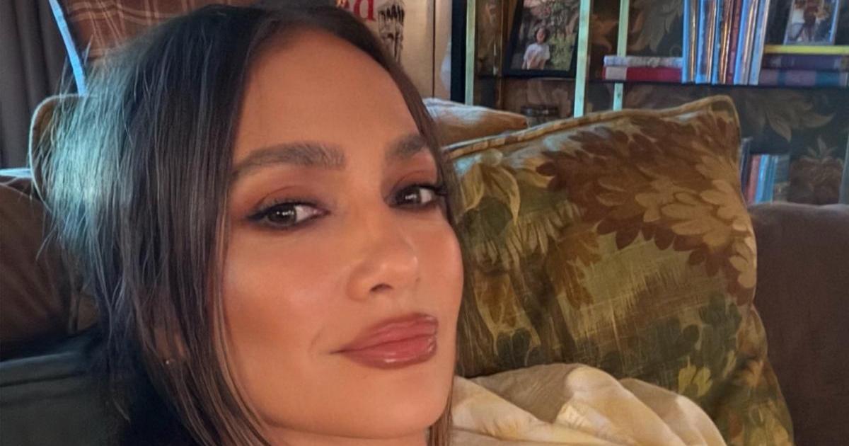 Jennifer Lopez's Cleavage-Baring Dress Clings to Her Curves in Right Places