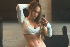 Jennifer Lopez’s Outerwear Can’t Quite Hide the Plunging Neckline of Her Bra Top