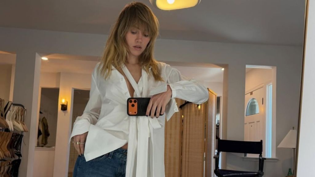 Suki Waterhouse’s Unbuttoned Auter Coat Shows Thigh-High Slit & Thong Peek