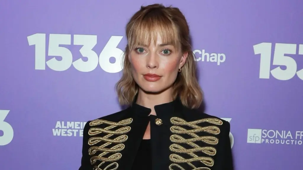 Margot Robbie’s Lacy Doen Top Hangs on for Dear Life With Micro Miniskirt