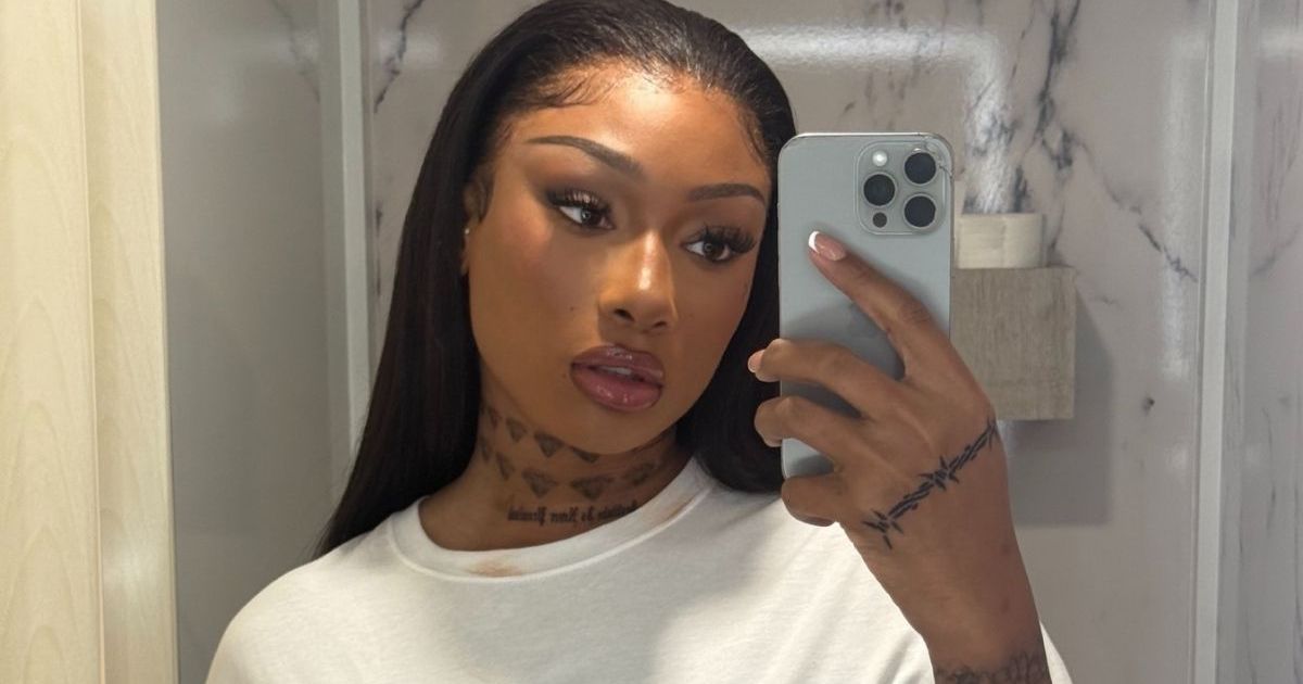 Megan Thee Stallion’s Tiny True Religion Scarf Top Hangs on for Dear Life