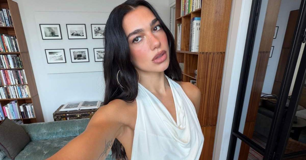 Dua Lipa’s Body-Hugging Fanci Club Top Puts Her Curves Front & Center