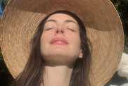 Anne Hathaway Almost Pops Out of Plunging Saint Laurent Striped Suit