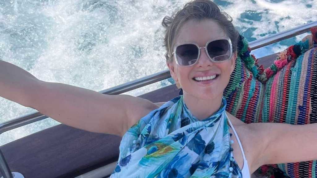 Elizabeth Hurley Nails Power Suiting in Plunging Joseph Ribkoff Look
