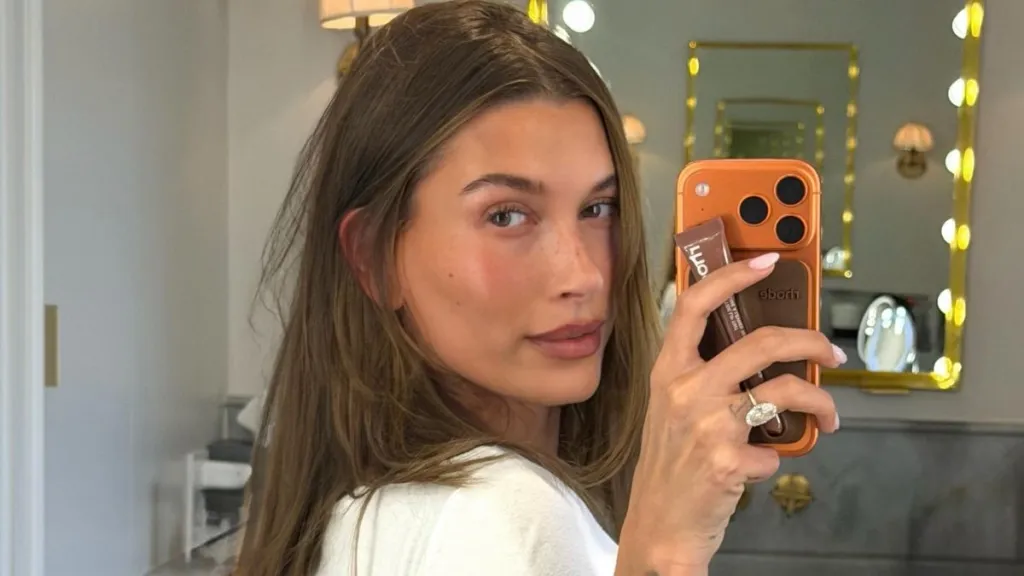 Hailey Bieber Is ‘Catching Feelings’ in a Skimpy Cami Top That Rides Up