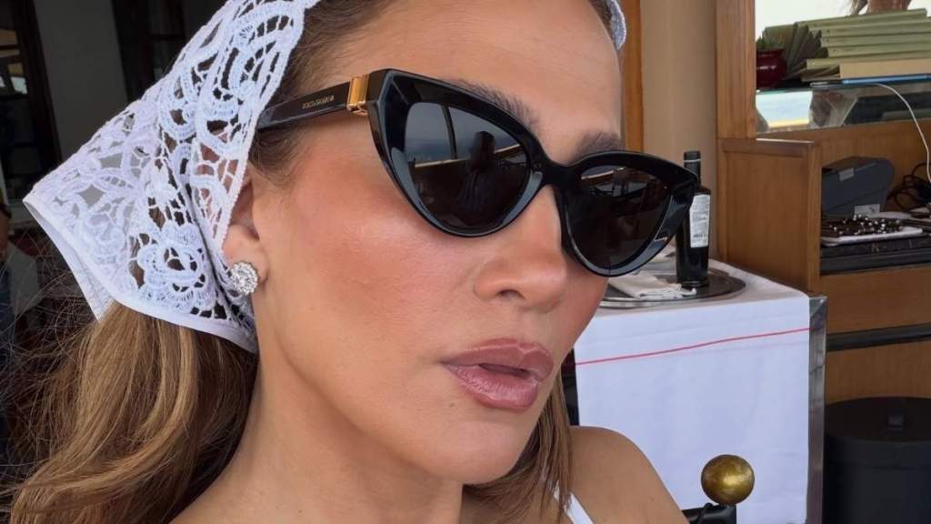 Jennifer Lopez Elevates Plunging Power Suit With Dezi Sunglasses