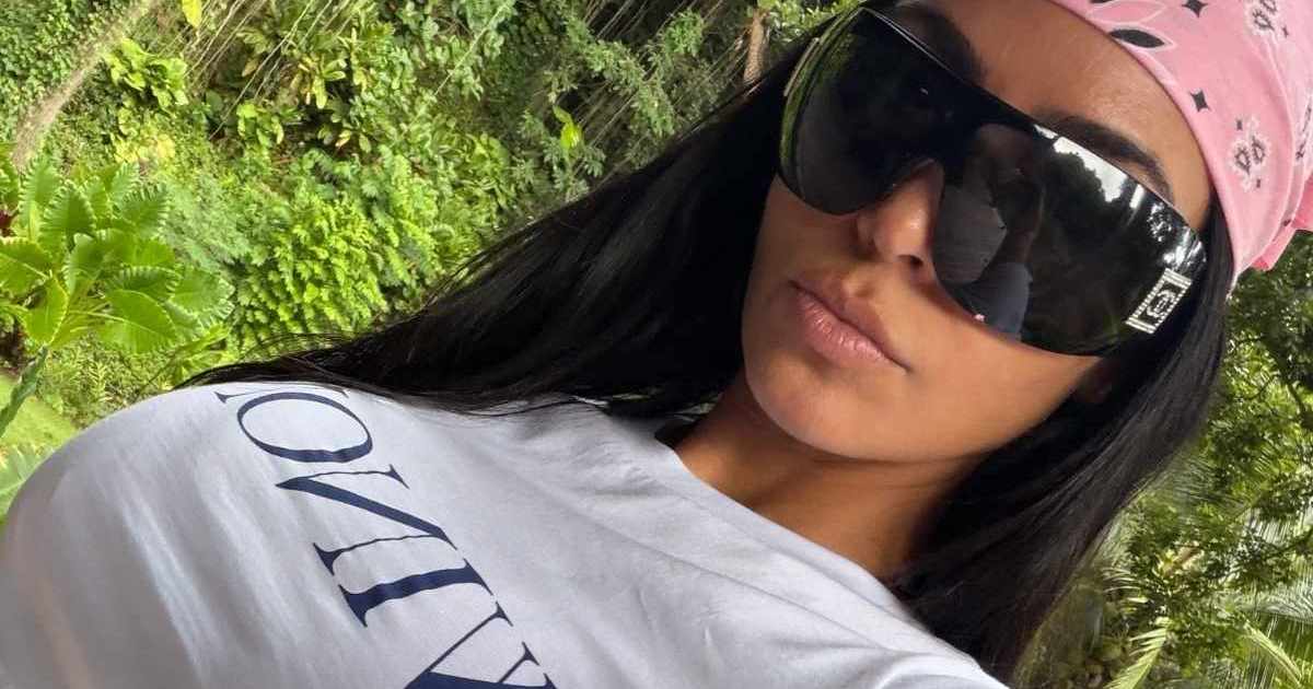 Kim Kardashian Keeps Her Pink Sweater Nearly Open on Holiday With Her Boyfriend