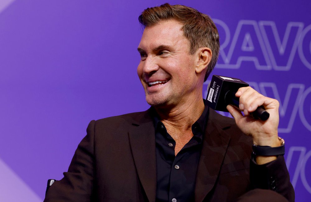 Jeff Lewis holding a microphone on stage at BravoCOn 2025