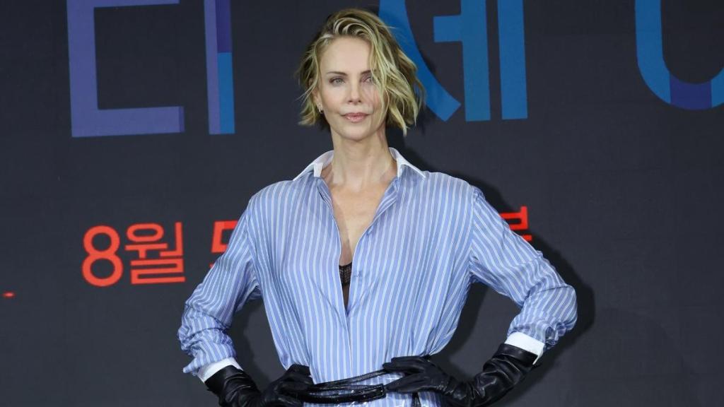 Charlize Theron Goes Pantless in Unbuttoned Tom Ford Shirt & Sheer Skirt
