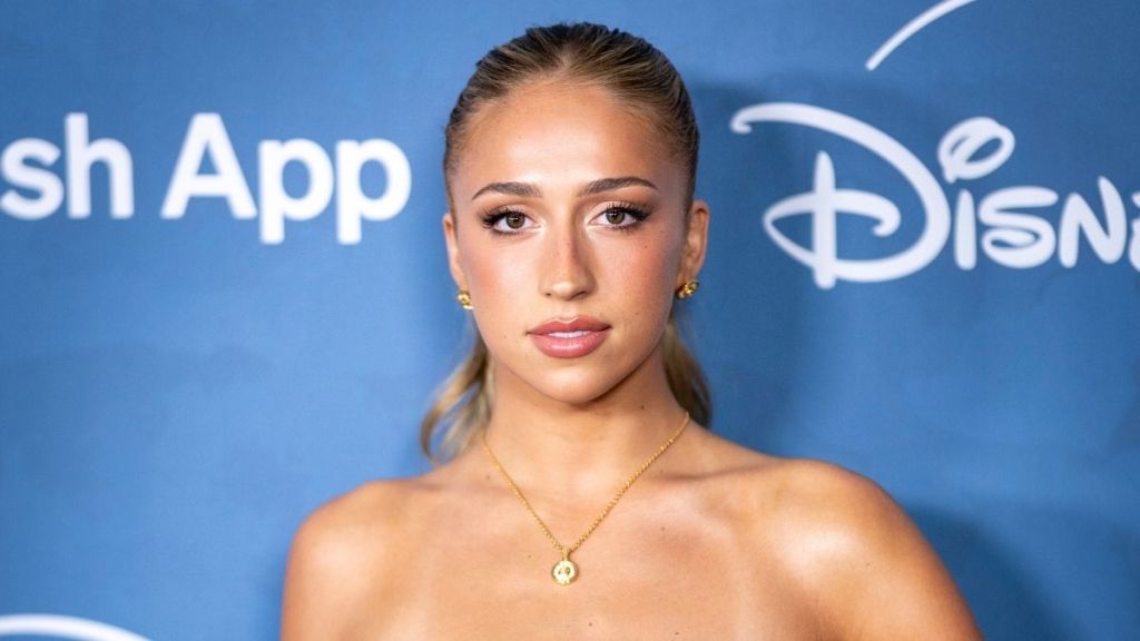 Tate McRae Elevates High-Slit Cutout Dress With Luxe Versace Jewelry