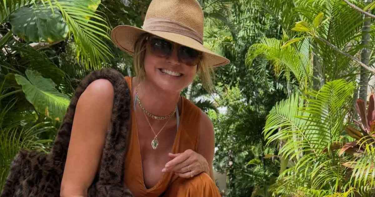 Heidi Klum Nearly Spills Out of Plunging Dress With Stringy Bikini Underneath