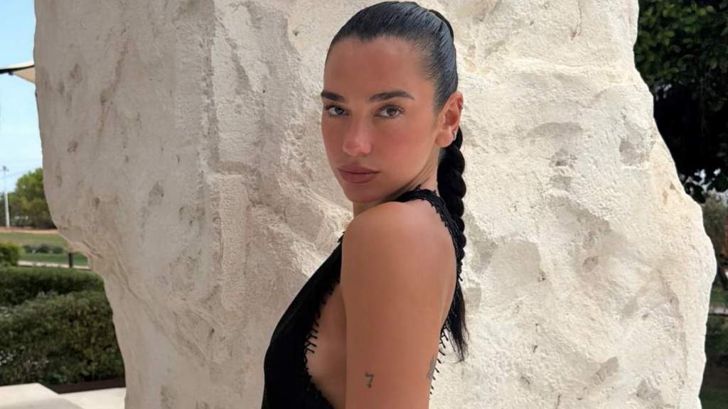 Dua Lipa Poses Topless Under Chanel Tweed Jacket for Vogue Italia