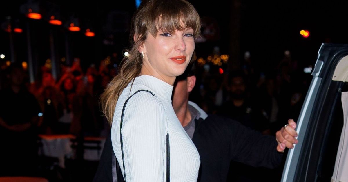 Taylor Swift Adds Bling to Micro Minidress With Christian Louboutin Bag