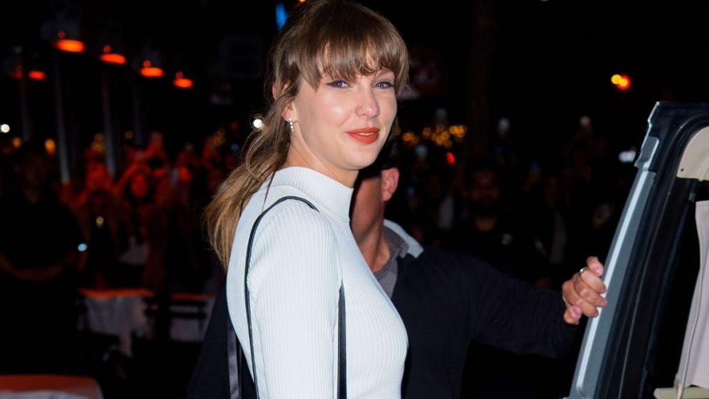 Taylor Swift Adds Bling to Micro Minidress With Christian Louboutin Bag