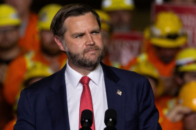 J.D. Vance speaking at a podium amid his blunt assessments of prominent political figures